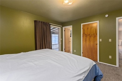 This one level home sits just off the 1st green of Lake Hills on Lake Hills Golf Course in Montana - for sale on GolfHomes.com, golf home, golf lot