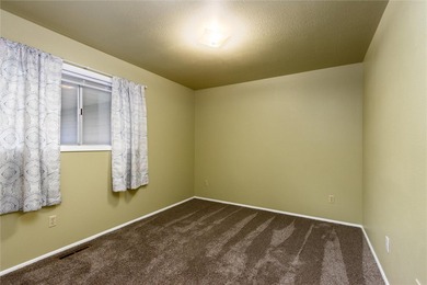 This one level home sits just off the 1st green of Lake Hills on Lake Hills Golf Course in Montana - for sale on GolfHomes.com, golf home, golf lot