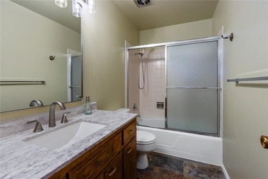 This one level home sits just off the 1st green of Lake Hills on Lake Hills Golf Course in Montana - for sale on GolfHomes.com, golf home, golf lot