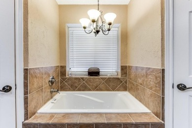 This charming three-bedroom brick home features a two-car garage on Lost Creek Golf Course in Texas - for sale on GolfHomes.com, golf home, golf lot