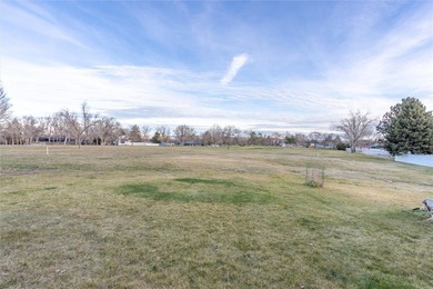 This one level home sits just off the 1st green of Lake Hills on Lake Hills Golf Course in Montana - for sale on GolfHomes.com, golf home, golf lot