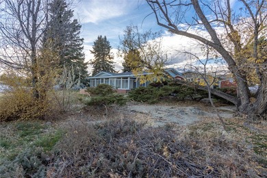 This one level home sits just off the 1st green of Lake Hills on Lake Hills Golf Course in Montana - for sale on GolfHomes.com, golf home, golf lot