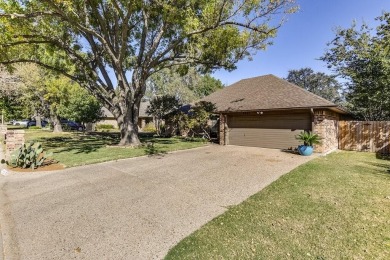 This charming three-bedroom brick home features a two-car garage on Lost Creek Golf Course in Texas - for sale on GolfHomes.com, golf home, golf lot