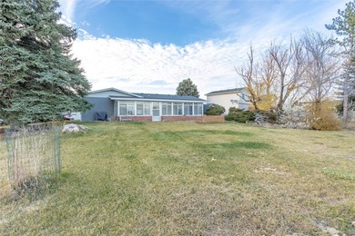 This one level home sits just off the 1st green of Lake Hills on Lake Hills Golf Course in Montana - for sale on GolfHomes.com, golf home, golf lot