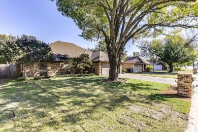 This charming three-bedroom brick home features a two-car garage on Lost Creek Golf Course in Texas - for sale on GolfHomes.com, golf home, golf lot