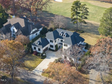 Backing to the 18th fairway of The Oaks course on a highly on North Ridge Country Club in North Carolina - for sale on GolfHomes.com, golf home, golf lot