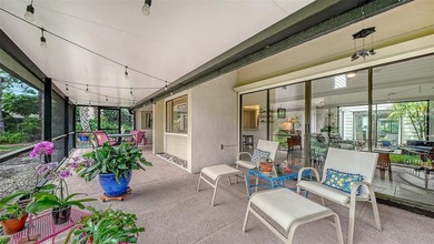 Move-in ready! Updated maintenance-free villa with serene pond on The Meadows Golf and Country Club in Florida - for sale on GolfHomes.com, golf home, golf lot