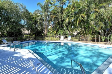 Move-in ready! Updated maintenance-free villa with serene pond on The Meadows Golf and Country Club in Florida - for sale on GolfHomes.com, golf home, golf lot