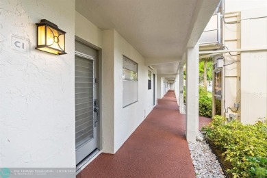 Resort-style living can be yours in the beautiful community of on Wynmoor Golf Course in Florida - for sale on GolfHomes.com, golf home, golf lot
