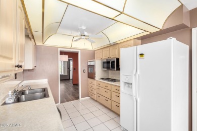 Step into this lovingly cared-for 2-bedroom, 2-bathroom home in on Sun City Lakes West and East in Arizona - for sale on GolfHomes.com, golf home, golf lot