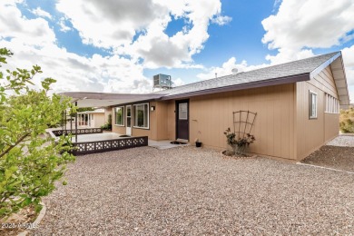 Step into this lovingly cared-for 2-bedroom, 2-bathroom home in on Sun City Lakes West and East in Arizona - for sale on GolfHomes.com, golf home, golf lot