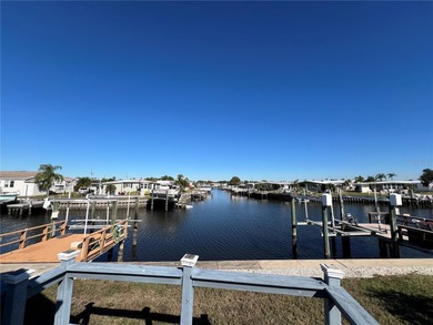 Affordable Saltwater Canal Waterfront Living with 40ft seawall on Mangrove Bay Golf Course in Florida - for sale on GolfHomes.com, golf home, golf lot