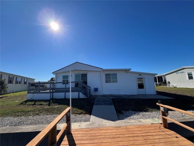 Affordable Saltwater Canal Waterfront Living with 40ft seawall on Mangrove Bay Golf Course in Florida - for sale on GolfHomes.com, golf home, golf lot