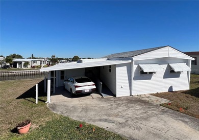 Affordable Saltwater Canal Waterfront Living with 40ft seawall on Mangrove Bay Golf Course in Florida - for sale on GolfHomes.com, golf home, golf lot