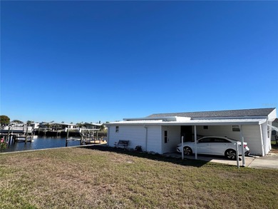 Affordable Saltwater Canal Waterfront Living with 40ft seawall on Mangrove Bay Golf Course in Florida - for sale on GolfHomes.com, golf home, golf lot