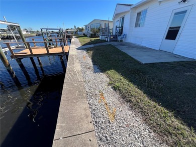 Affordable Saltwater Canal Waterfront Living with 40ft seawall on Mangrove Bay Golf Course in Florida - for sale on GolfHomes.com, golf home, golf lot