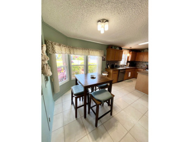 Move right into this furnished two-bedroom, two-bath home on Pine Lakes Country Club in Florida - for sale on GolfHomes.com, golf home, golf lot