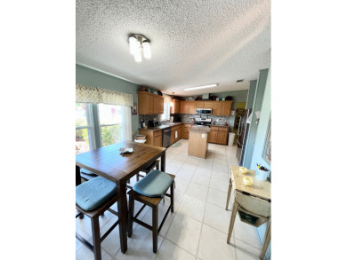 Move right into this furnished two-bedroom, two-bath home on Pine Lakes Country Club in Florida - for sale on GolfHomes.com, golf home, golf lot