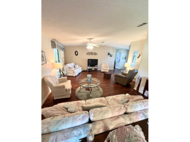Move right into this furnished two-bedroom, two-bath home on Pine Lakes Country Club in Florida - for sale on GolfHomes.com, golf home, golf lot
