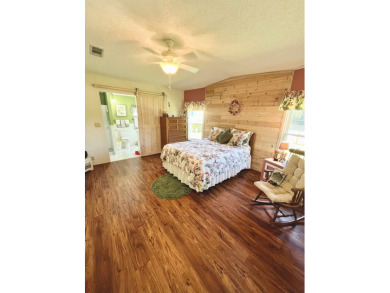 Move right into this furnished two-bedroom, two-bath home on Pine Lakes Country Club in Florida - for sale on GolfHomes.com, golf home, golf lot
