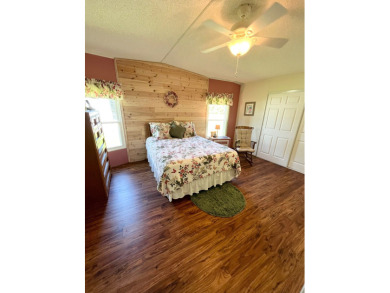 Move right into this furnished two-bedroom, two-bath home on Pine Lakes Country Club in Florida - for sale on GolfHomes.com, golf home, golf lot