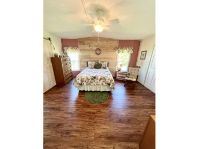 Move right into this furnished two-bedroom, two-bath home on Pine Lakes Country Club in Florida - for sale on GolfHomes.com, golf home, golf lot