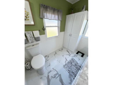 Move right into this furnished two-bedroom, two-bath home on Pine Lakes Country Club in Florida - for sale on GolfHomes.com, golf home, golf lot
