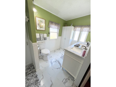 Move right into this furnished two-bedroom, two-bath home on Pine Lakes Country Club in Florida - for sale on GolfHomes.com, golf home, golf lot