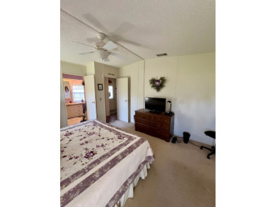 Move right into this furnished two-bedroom, two-bath home on Pine Lakes Country Club in Florida - for sale on GolfHomes.com, golf home, golf lot