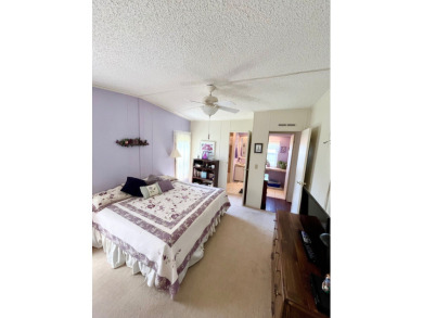 Move right into this furnished two-bedroom, two-bath home on Pine Lakes Country Club in Florida - for sale on GolfHomes.com, golf home, golf lot