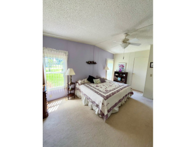 Move right into this furnished two-bedroom, two-bath home on Pine Lakes Country Club in Florida - for sale on GolfHomes.com, golf home, golf lot