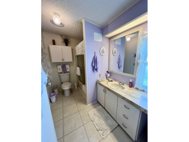 Move right into this furnished two-bedroom, two-bath home on Pine Lakes Country Club in Florida - for sale on GolfHomes.com, golf home, golf lot
