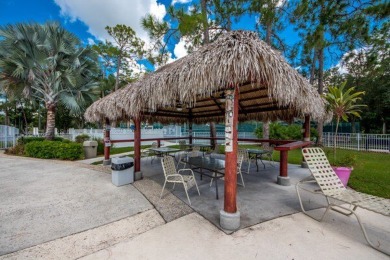 Move right into this furnished two-bedroom, two-bath home on Pine Lakes Country Club in Florida - for sale on GolfHomes.com, golf home, golf lot