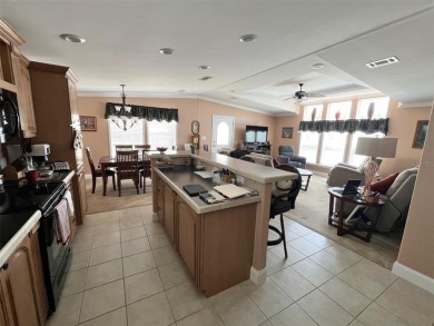 Spacious and Well-Built to Wind Zone III Standards, 2011 Palm on Mangrove Bay Golf Course in Florida - for sale on GolfHomes.com, golf home, golf lot