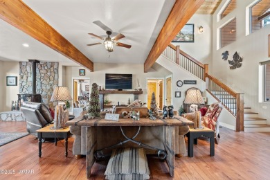 Discover timeless elegance and serene lake views in this on Pinetop Lakes Country Club in Arizona - for sale on GolfHomes.com, golf home, golf lot