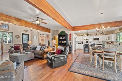 Discover timeless elegance and serene lake views in this on Pinetop Lakes Country Club in Arizona - for sale on GolfHomes.com, golf home, golf lot
