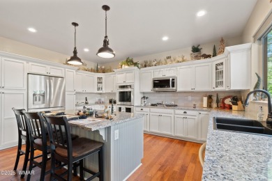 Discover timeless elegance and serene lake views in this on Pinetop Lakes Country Club in Arizona - for sale on GolfHomes.com, golf home, golf lot