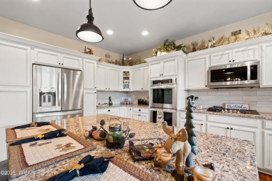 Discover timeless elegance and serene lake views in this on Pinetop Lakes Country Club in Arizona - for sale on GolfHomes.com, golf home, golf lot