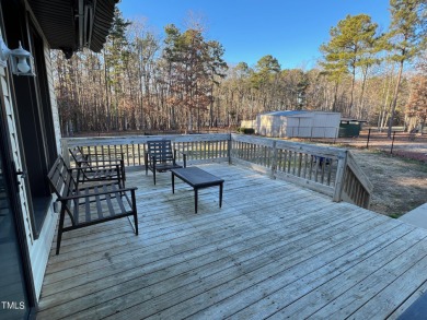 Spacious lake home on 2.9 acre lot with boat dock in place. on Kerr Lake Country Club in North Carolina - for sale on GolfHomes.com, golf home, golf lot