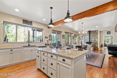 Discover timeless elegance and serene lake views in this on Pinetop Lakes Country Club in Arizona - for sale on GolfHomes.com, golf home, golf lot
