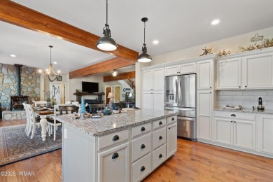 Discover timeless elegance and serene lake views in this on Pinetop Lakes Country Club in Arizona - for sale on GolfHomes.com, golf home, golf lot