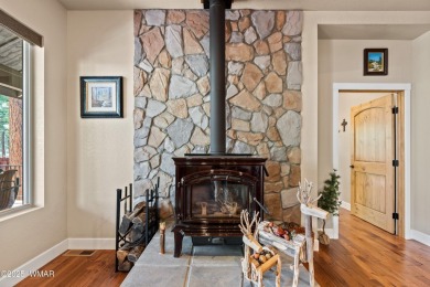 Discover timeless elegance and serene lake views in this on Pinetop Lakes Country Club in Arizona - for sale on GolfHomes.com, golf home, golf lot