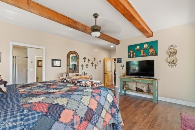 Discover timeless elegance and serene lake views in this on Pinetop Lakes Country Club in Arizona - for sale on GolfHomes.com, golf home, golf lot