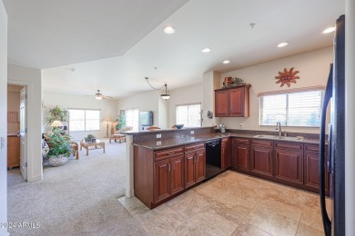 This top-floor condo is the perfect lock and leave living in a on Wildfire Golf Club in Arizona - for sale on GolfHomes.com, golf home, golf lot