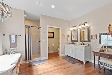 Discover timeless elegance and serene lake views in this on Pinetop Lakes Country Club in Arizona - for sale on GolfHomes.com, golf home, golf lot