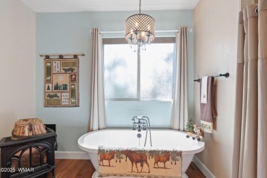 Discover timeless elegance and serene lake views in this on Pinetop Lakes Country Club in Arizona - for sale on GolfHomes.com, golf home, golf lot