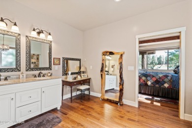 Discover timeless elegance and serene lake views in this on Pinetop Lakes Country Club in Arizona - for sale on GolfHomes.com, golf home, golf lot