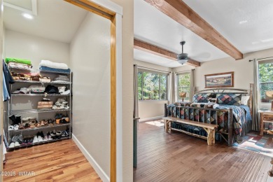 Discover timeless elegance and serene lake views in this on Pinetop Lakes Country Club in Arizona - for sale on GolfHomes.com, golf home, golf lot