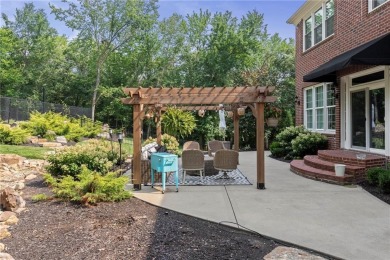 Custom built home on private, large, treed lot with lake views on Loch Lloyd Country Club in Missouri - for sale on GolfHomes.com, golf home, golf lot