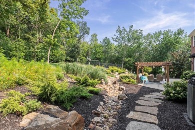 Custom built home on private, large, treed lot with lake views on Loch Lloyd Country Club in Missouri - for sale on GolfHomes.com, golf home, golf lot